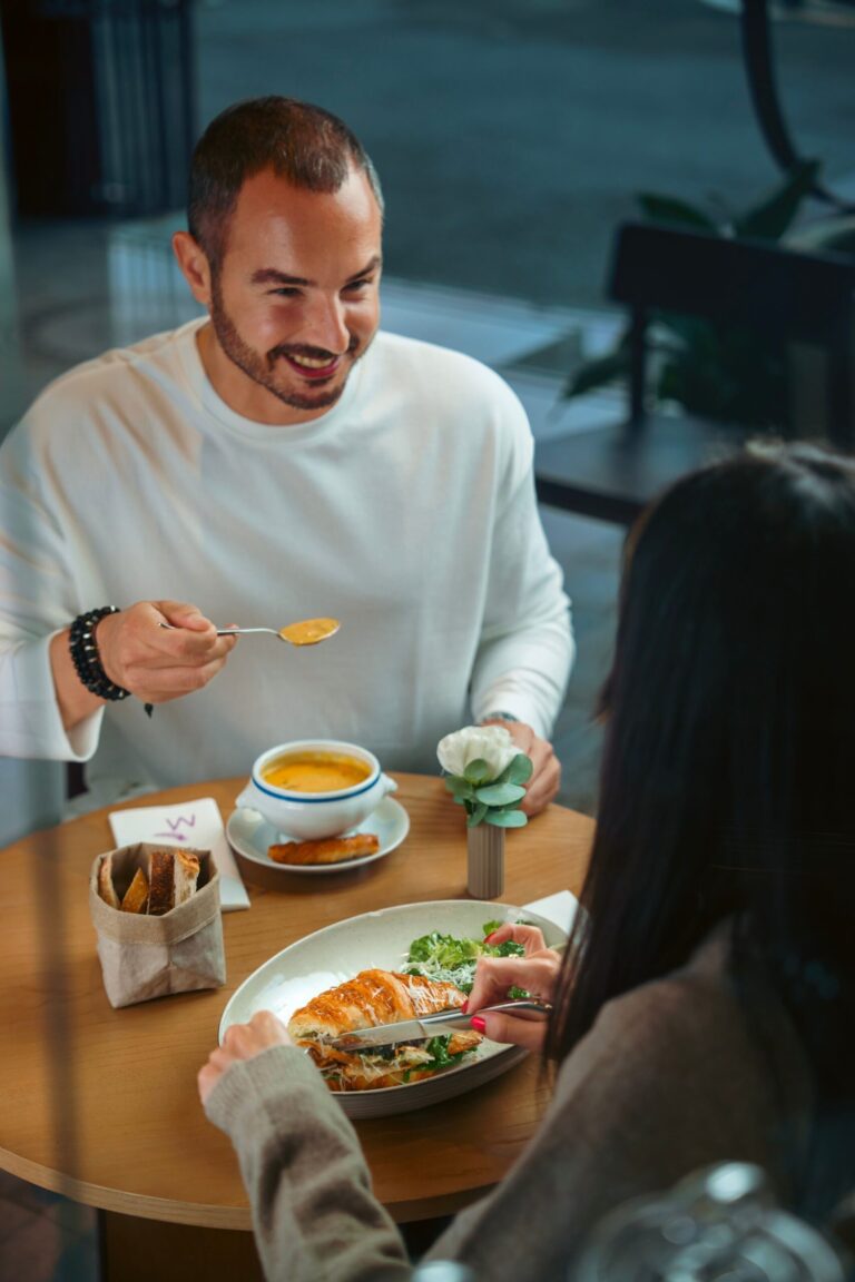 Smiling guest dining at a table
