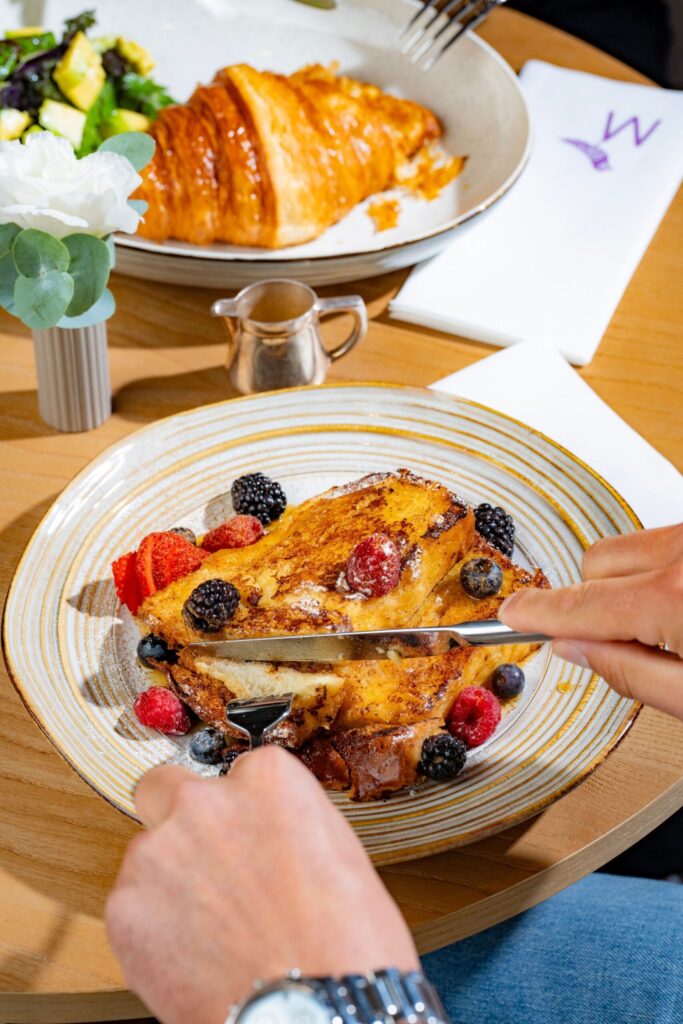French toast with fresh berries and a croissant