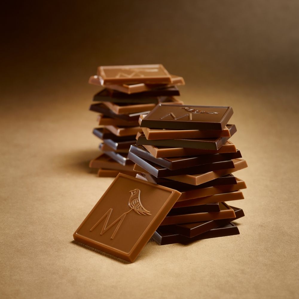 Stack of Madlen chocolate bars with the M logo