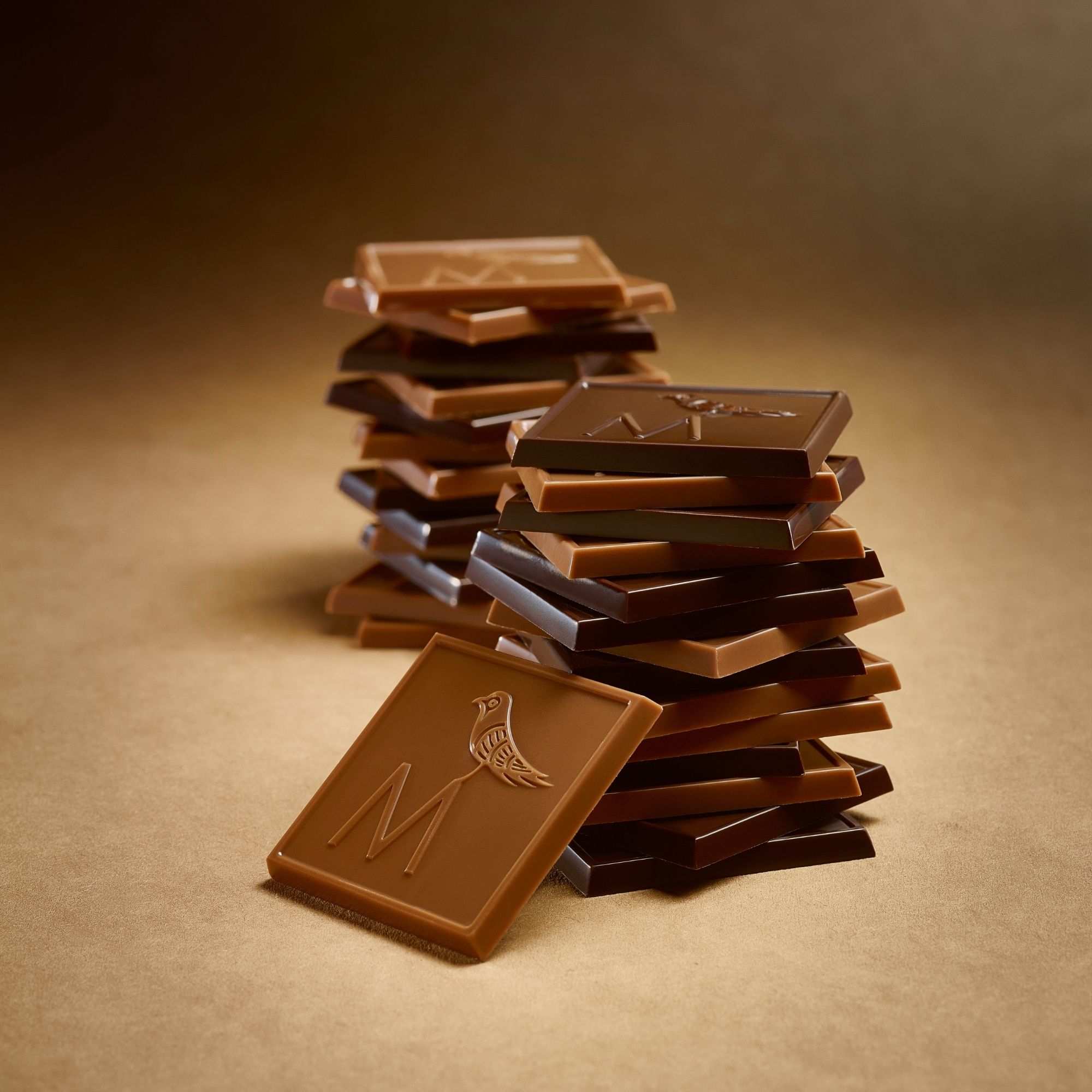 Stack of Madlen chocolate bars with the M logo
