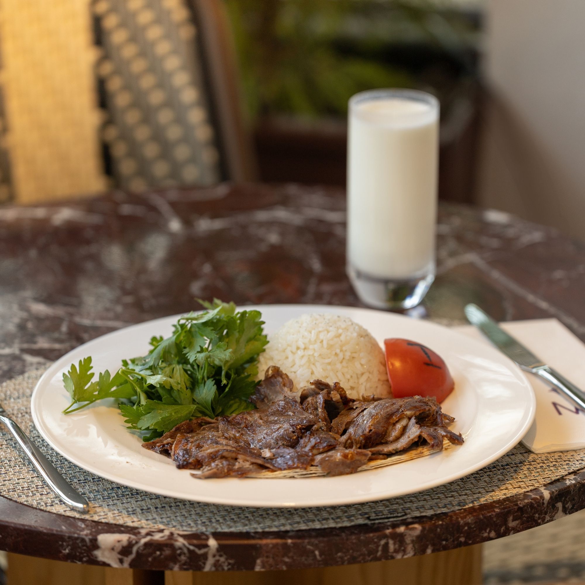 Grilled meat plate served with ayran