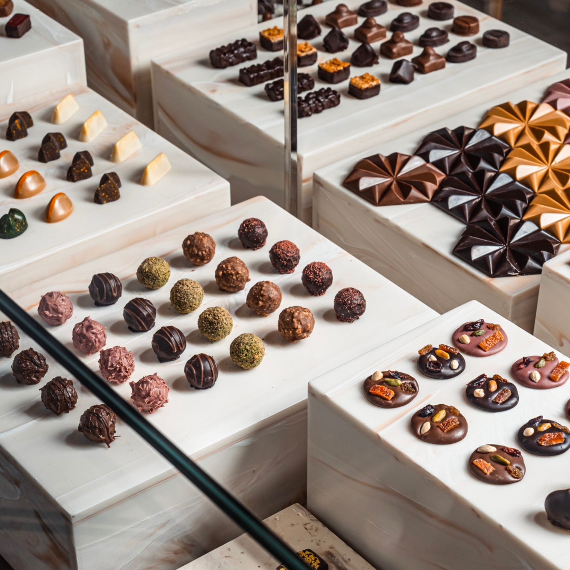 Praline chocolates on a marble display