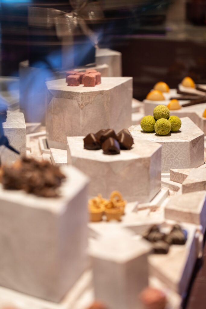 Chocolates and truffles displayed on plinths